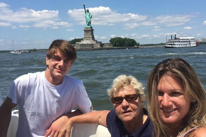 Boat Tour NYC Skyline, Statue of Liberty, Private Yacht Tour - Beneath the George Washington Bridge and beside the Little Red Lighthouse