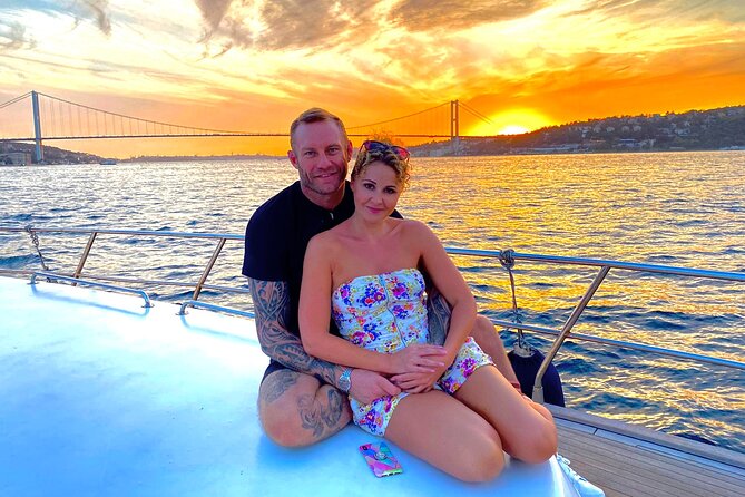 Bosphorus Sunset Yacht Cruise with Snacks and Live Guide - A small yacht with several places to sit