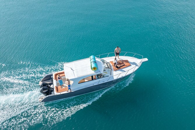 Exclusive Isla Mujeres and Cancun Private Yacht Tour - Snorkeling in clear Caribbean water