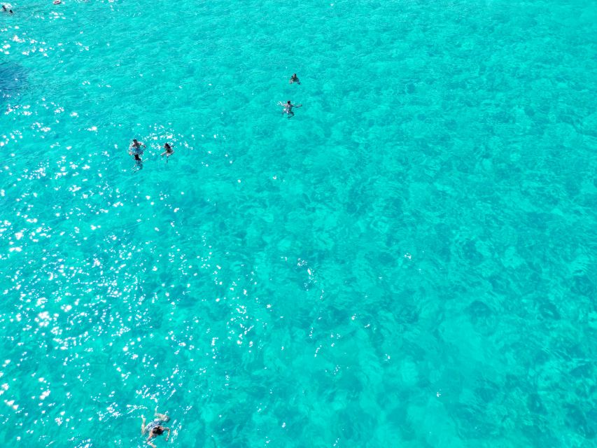 From Trapani: Favignana and Levanzo Yacht Tour with Stops - The extra €5 fee and departure details