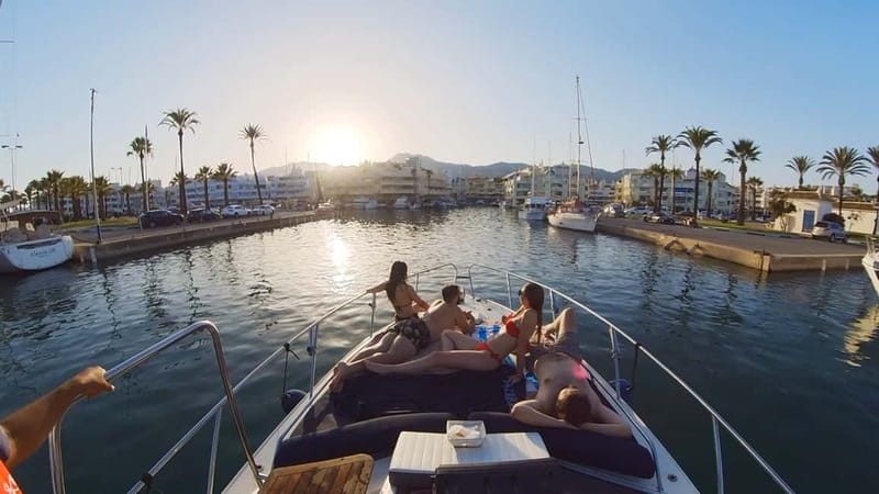 Fuengirola: Magical Sunset Yacht Tour - Leaving Fuengirola behind at sunset