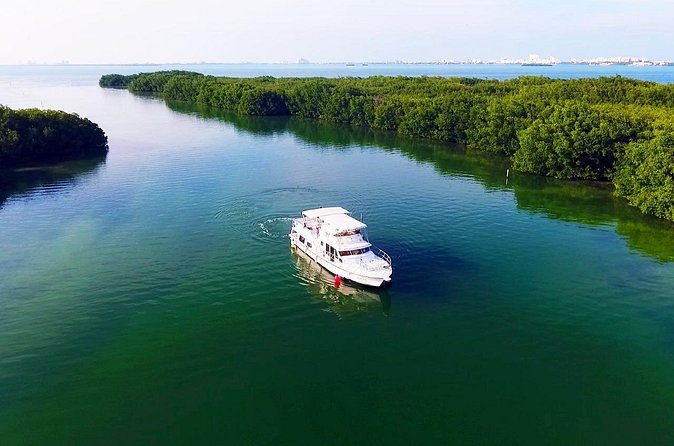 Isla Mujeres Full Day Tour on Yacht with Snorkel and Buffet - Music, games, and the sunset sail back
