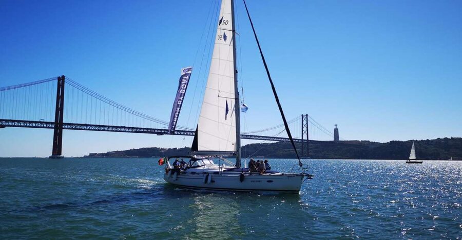 Lisbon: 2-Hour Sailing Yacht Cruise & Guided Tour w/2 drinks - Two drinks and the pace on board
