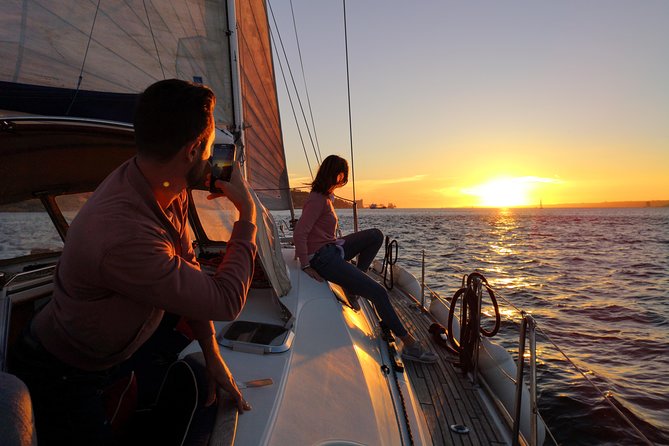 Lisbon Sunset Sailing Tour on Luxury Sailing Yacht with 2 Drinks - Wine, beer, cheese, and chouriço at sunset