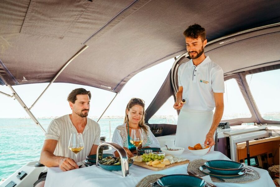 Portimao: Sunrise Luxury Sail-Yacht Cruise - Reading the Algarve coast from the water