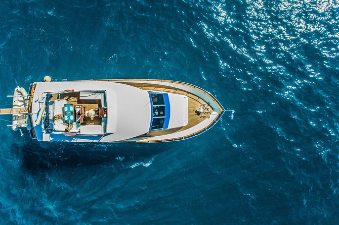Santorini: Motor Yacht Private Cruise with 5-Course Meal - Through the caldera and past the volcano