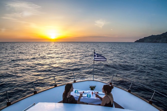 Santorini: Motor Yacht Sunset Cruise with 5-Course Dinner - Crossing the caldera between the two Kameni islands