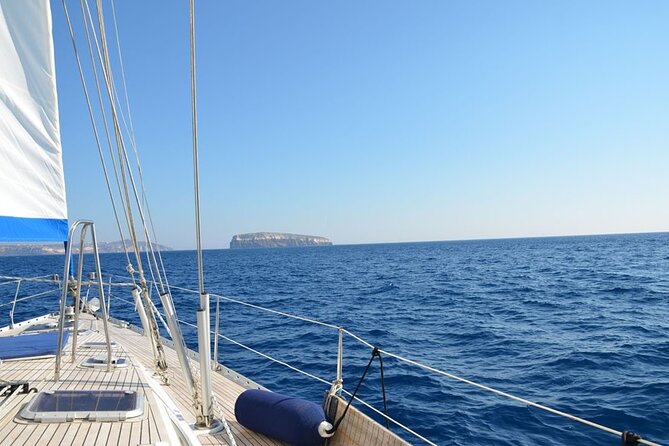 Santorini: Private Sailing Yacht Cruise with Meal and Drinks - Sailing below Santorini’s famous cliffs