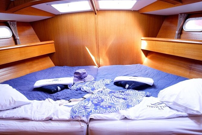 Santorini: Private Sailing Yacht Cruise with Meal and Drinks - The volcanic waters around Nea Kameni