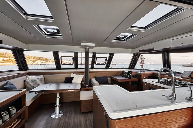 Santorini Private Tour Half-Day Sailing Platinum Catamaran Cruise - The Akrotiri lighthouse and the southwest coast