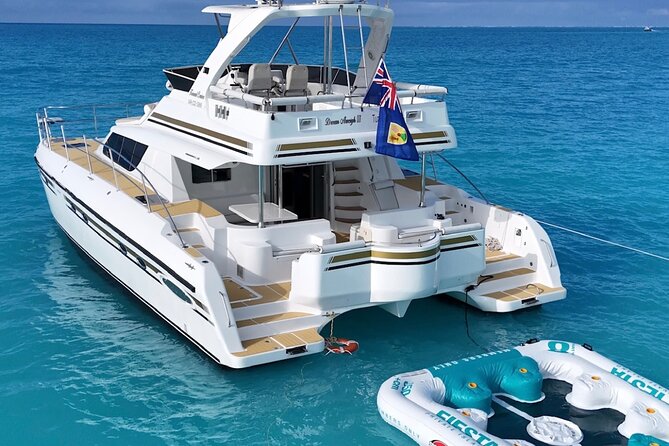 Turks and Caicos Full-Day Luxury Private Yacht Charter - A quiet beach and lunch aboard the yacht